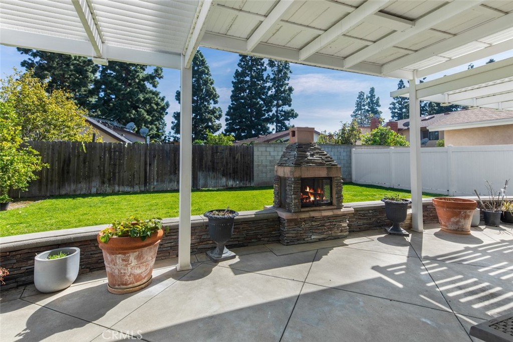 14612 Emerywood Road Tustin, CA 92780 - Photo 38 of 50 Backyard fireplace and covered patio