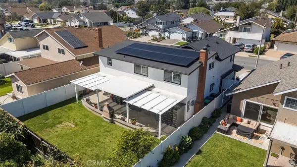 an aerial view of a house with a yard
