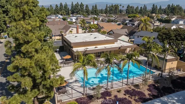 a view of a house with yard and sitting area