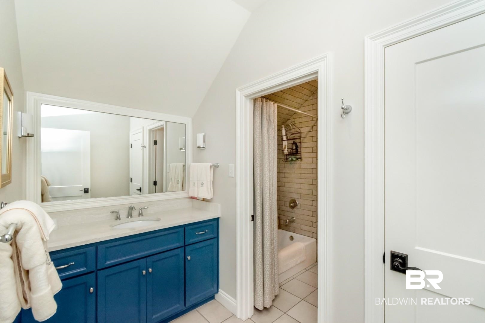 4404 Stein Street Mobile, AL 36608 - Photo 39 of 50 Full bath with shower / bath combo with shower curtain, light tile patterned flooring, and vanity