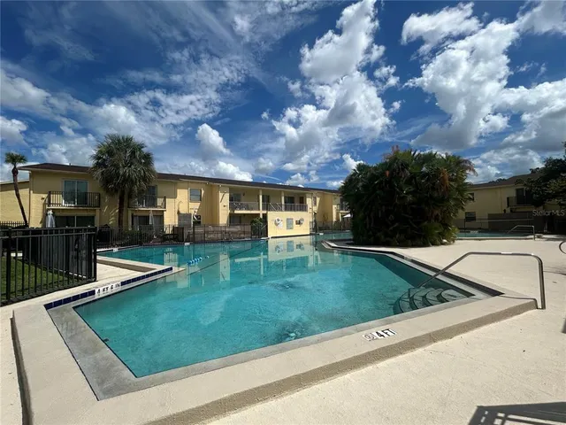 a view of a backyard with sitting area