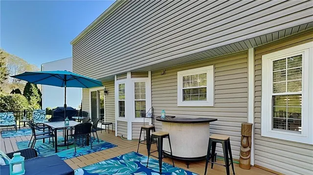 a patio with a table and chairs
