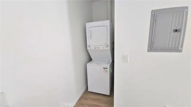 a room with a mirror and a white door