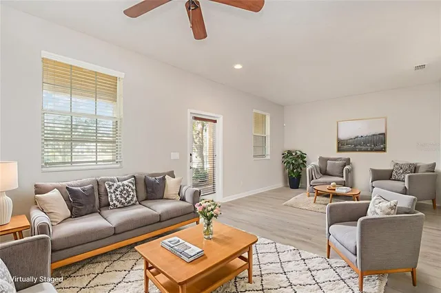 a living room with furniture and a window