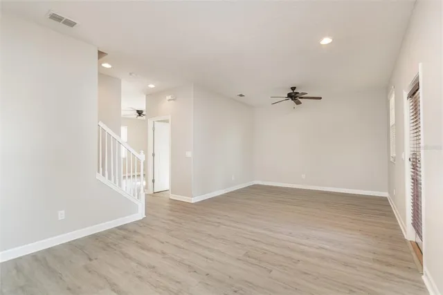 a view of an entryway with wooden floor