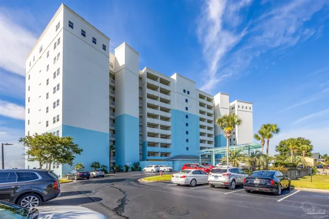 a building with cars parked in front of it