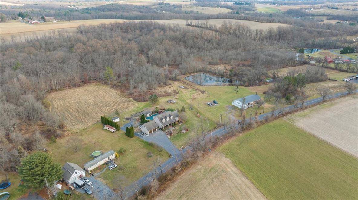 988 Hoch Road Danielsville, PA 18038 - Photo 27 of 29 Discover a private estate featuring a tranquil pond, swimming pool, and acres of peaceful rural scenery.