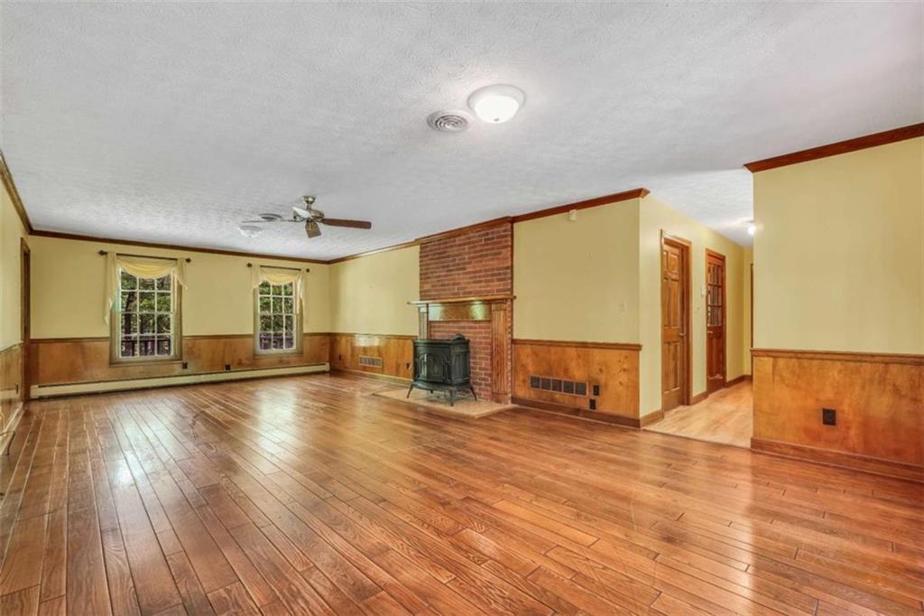 314 Winding Stream Trail Southwest Conyers, GA 30094 - Photo 22 of 59 a view of empty room with wooden floor and fan