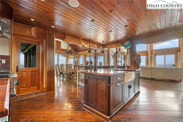 a kitchen with stainless steel appliances granite countertop a stove and cabinets