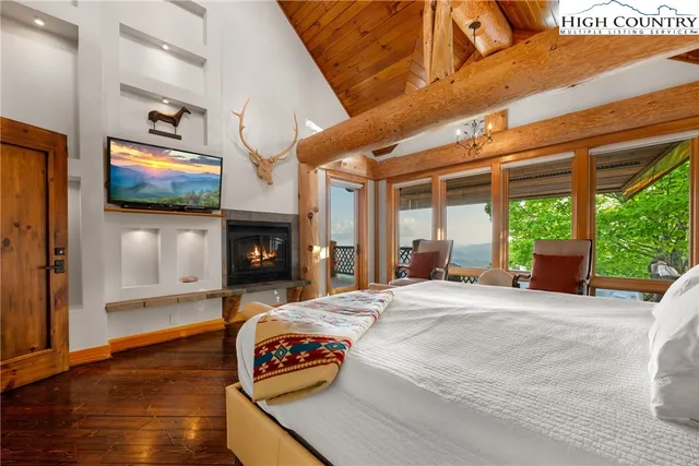 a living room with fireplace furniture and a flat screen tv