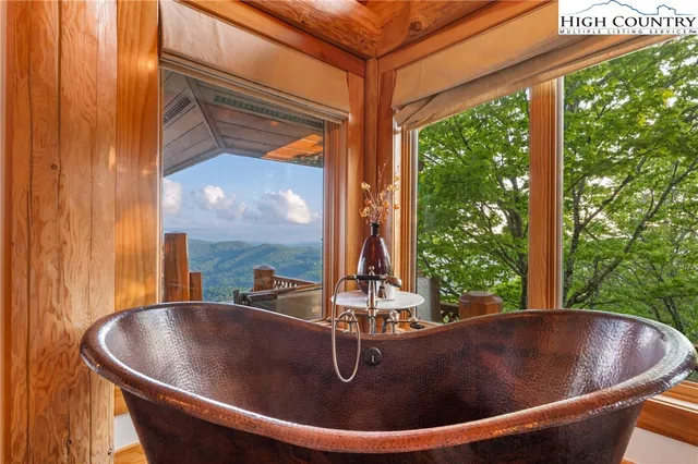 a living room with fireplace furniture and a flat screen tv