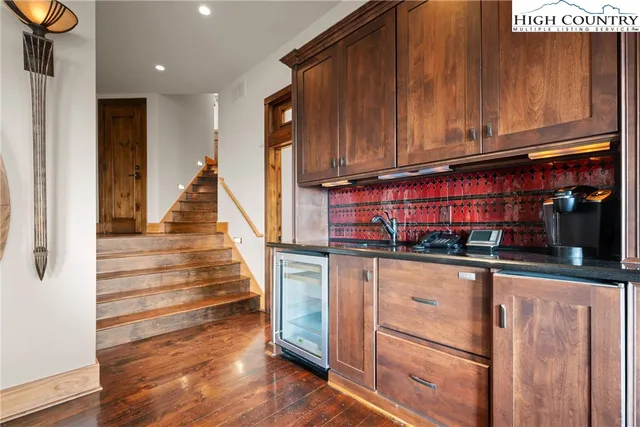 a view of an entryway with wooden floor