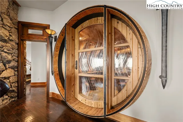 a floor to ceiling window with a swimming pool