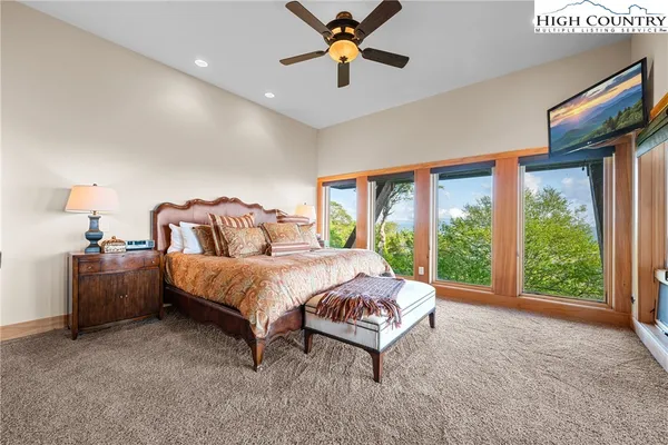 a bathroom with a granite countertop sink a toilet and shower