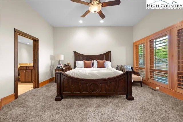 a kitchen with a sink and chairs