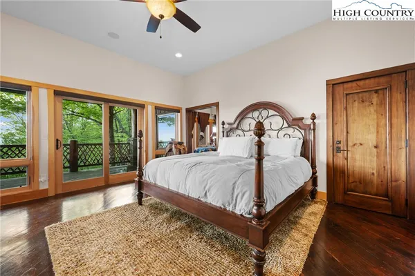 a bathroom with a sink a mirror a vanity and shower