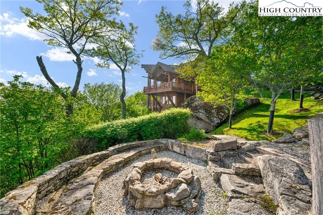 a kitchen with granite countertop a stove and a wooden cabinets