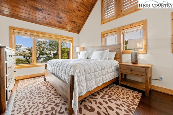a view of a kitchen with a sink and wooden floor