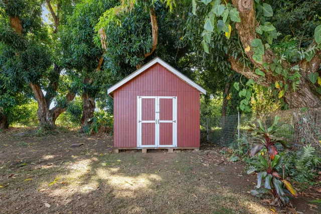 a backyard of a house with lots of green space