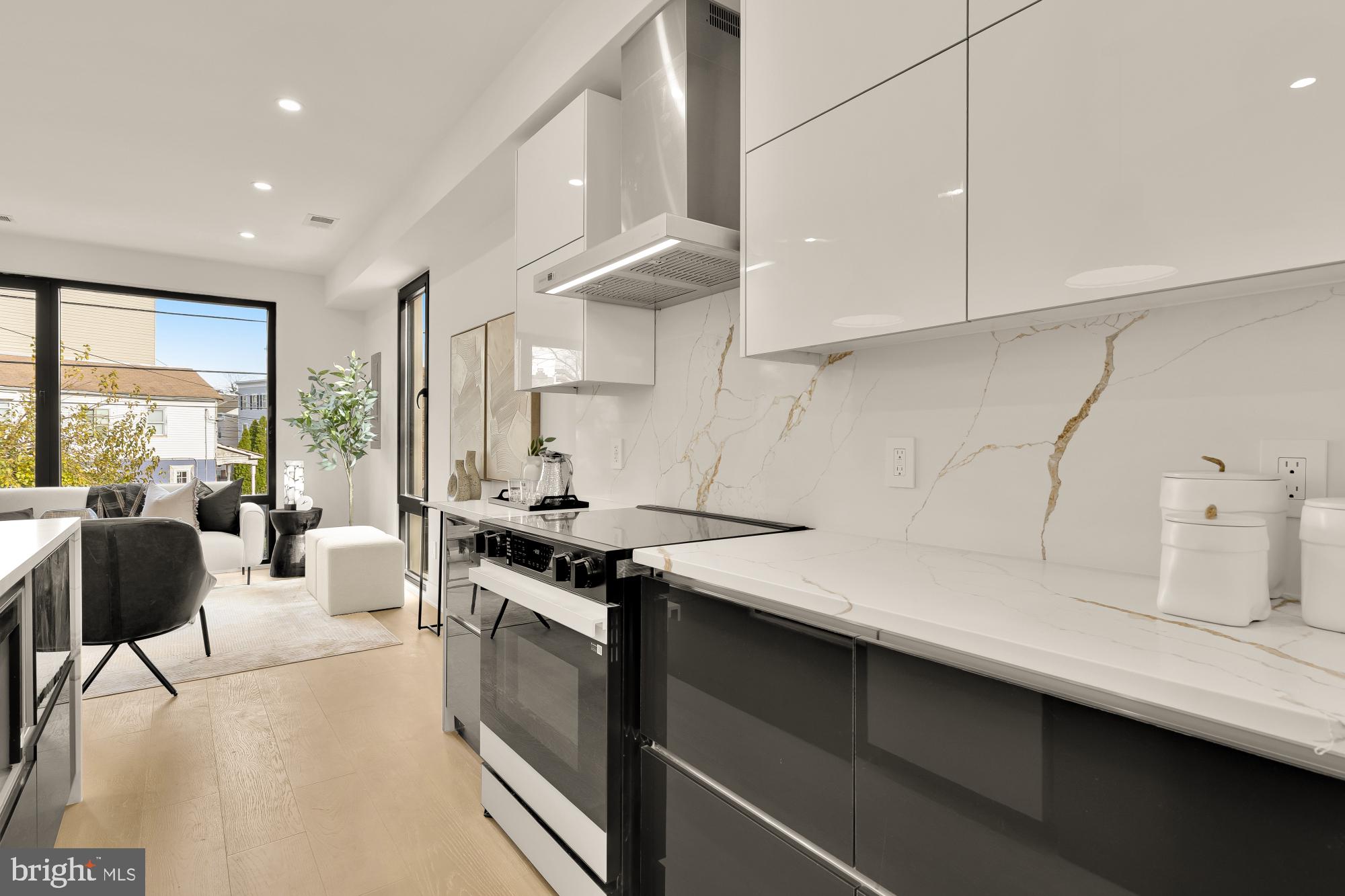 1810 Central Place Northeast, Unit 2 Washington, DC 20002 - Photo 13 of 34 a kitchen with a sink a stove and cabinets