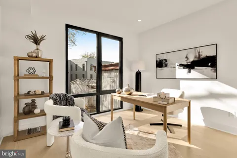 a workspace with furniture and window