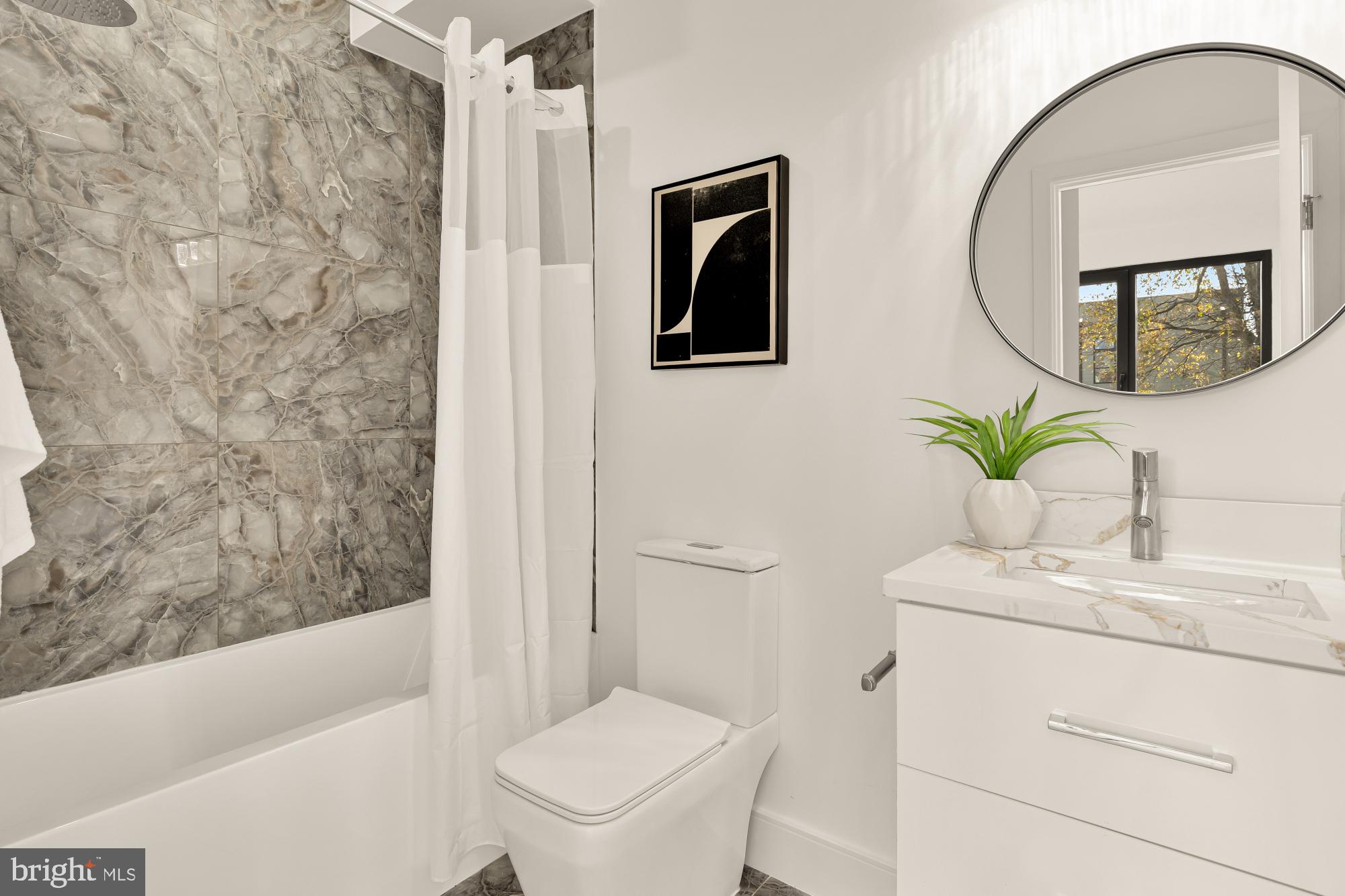 1810 Central Place Northeast, Unit 2 Washington, DC 20002 - Photo 18 of 34 a bathroom with a sink toilet and a bathtub