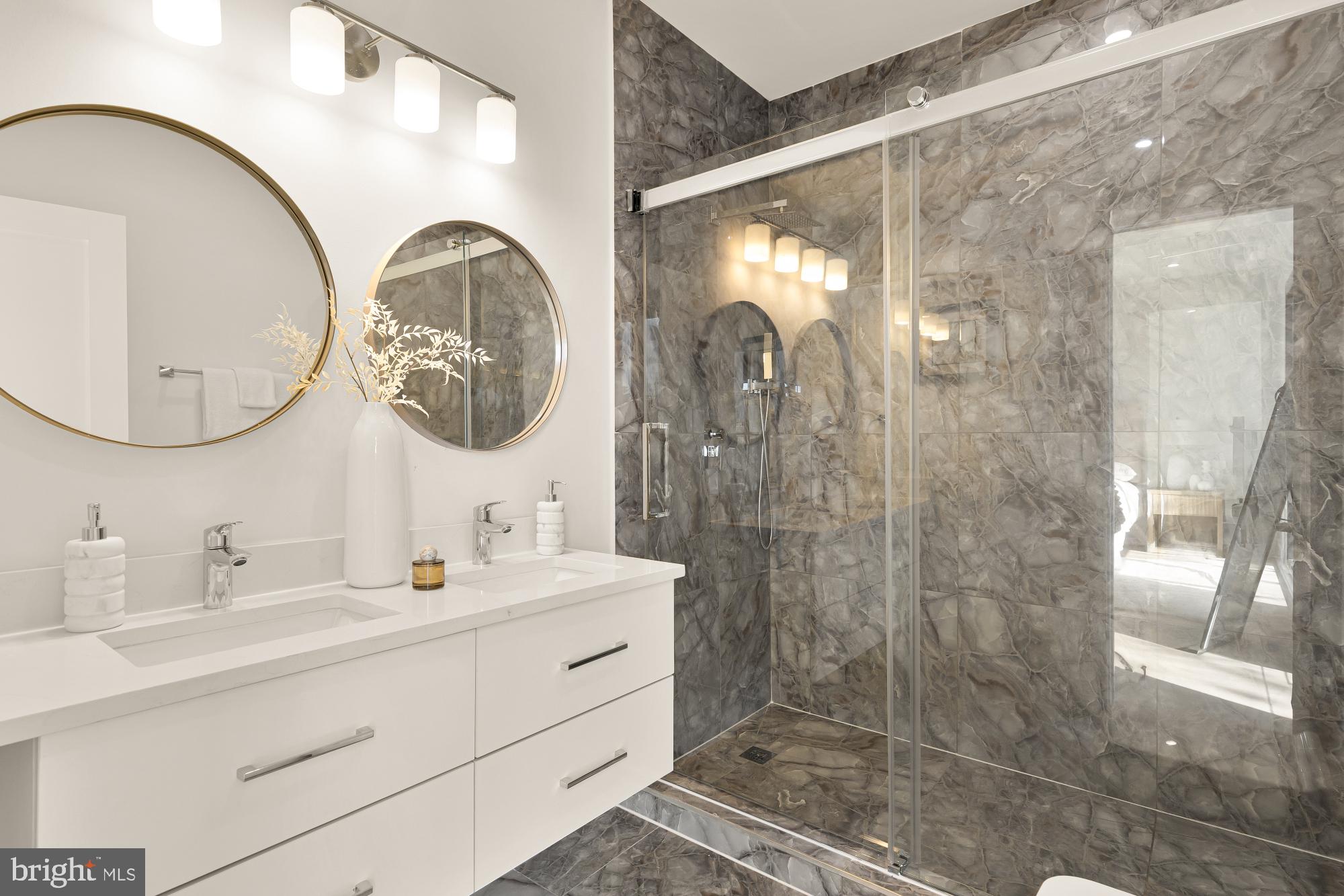 1810 Central Place Northeast, Unit 2 Washington, DC 20002 - Photo 23 of 34 a bathroom with a double vanity sink mirror and shower