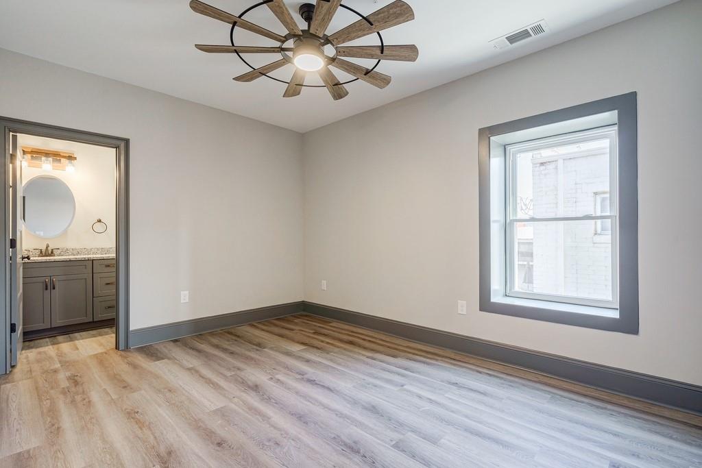 34 Depot Street, Unit 24 Hartwell, GA 30643 - Photo 14 of 22 wooden floor in an empty room with a window