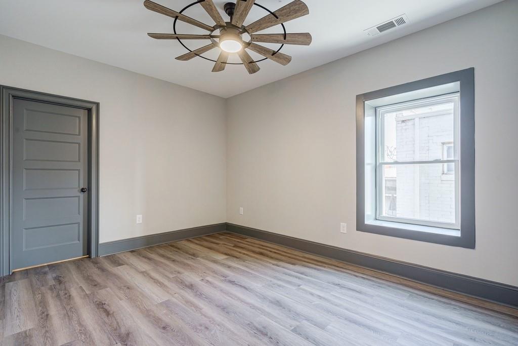 34 Depot Street, Unit 24 Hartwell, GA 30643 - Photo 15 of 22 an empty room with wooden floor closet and windows