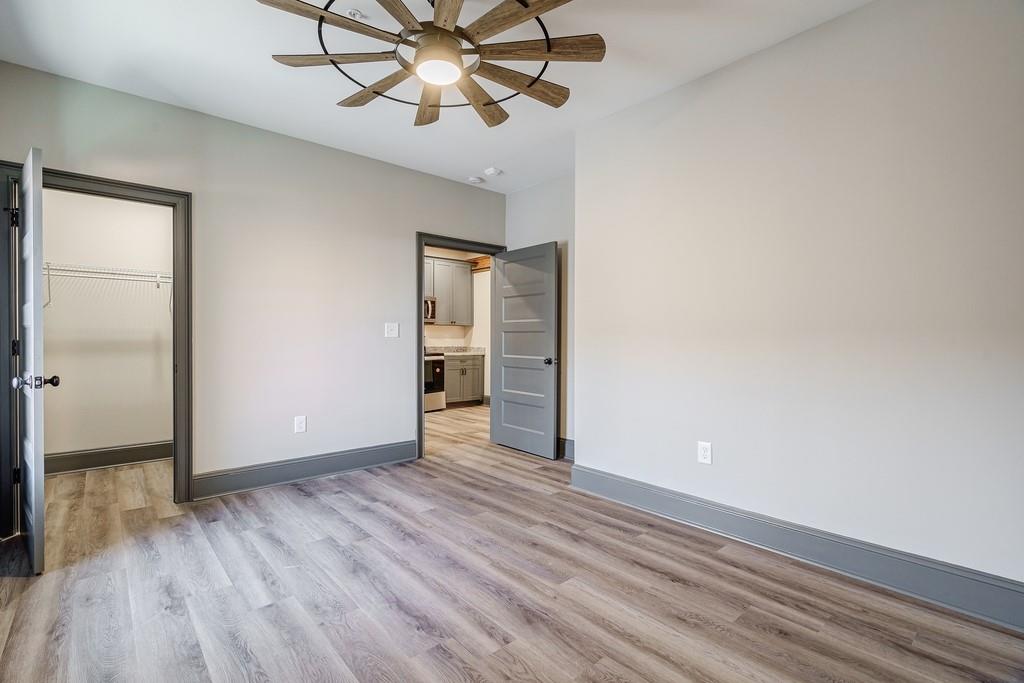 34 Depot Street, Unit 24 Hartwell, GA 30643 - Photo 16 of 22 wooden floor in an empty room with a window