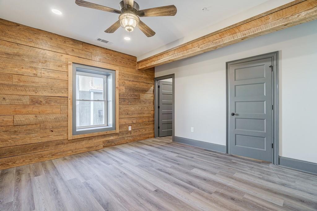 34 Depot Street, Unit 24 Hartwell, GA 30643 - Photo 20 of 22 a view of an empty room with wooden floor and a window