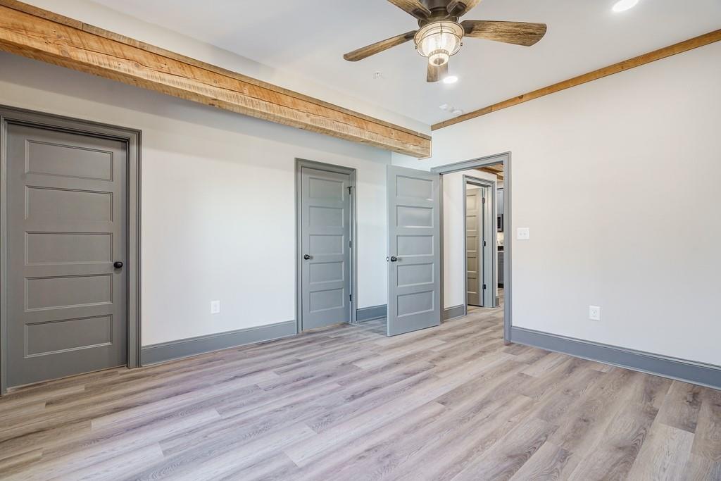 34 Depot Street, Unit 24 Hartwell, GA 30643 - Photo 22 of 22 wooden floor in an empty room with a window
