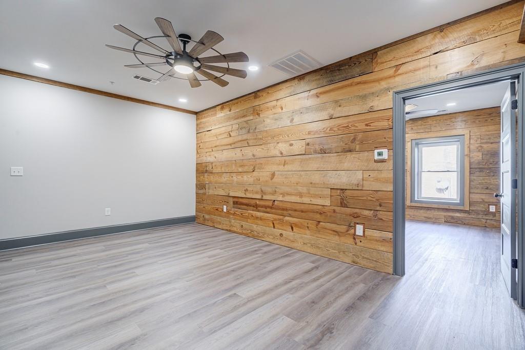 34 Depot Street, Unit 24 Hartwell, GA 30643 - Photo 6 of 22 wooden floor in an empty room with a window