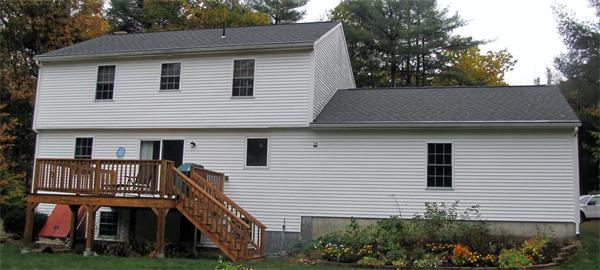 32 Newton Road Westminster, MA 01473 - Photo 4 of 21 a front view of house with yard and trees in the background