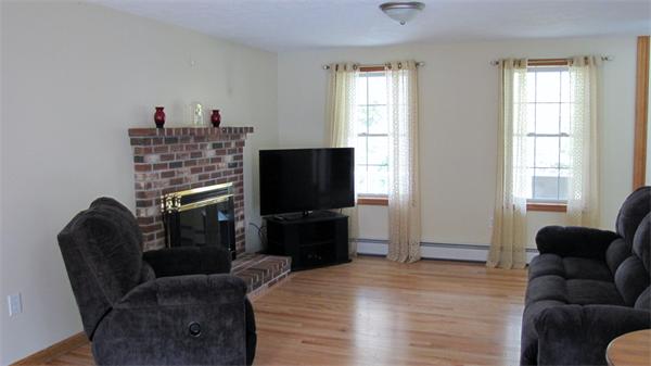 32 Newton Road Westminster, MA 01473 - Photo 8 of 21 a living room with furniture a flat screen tv and a window