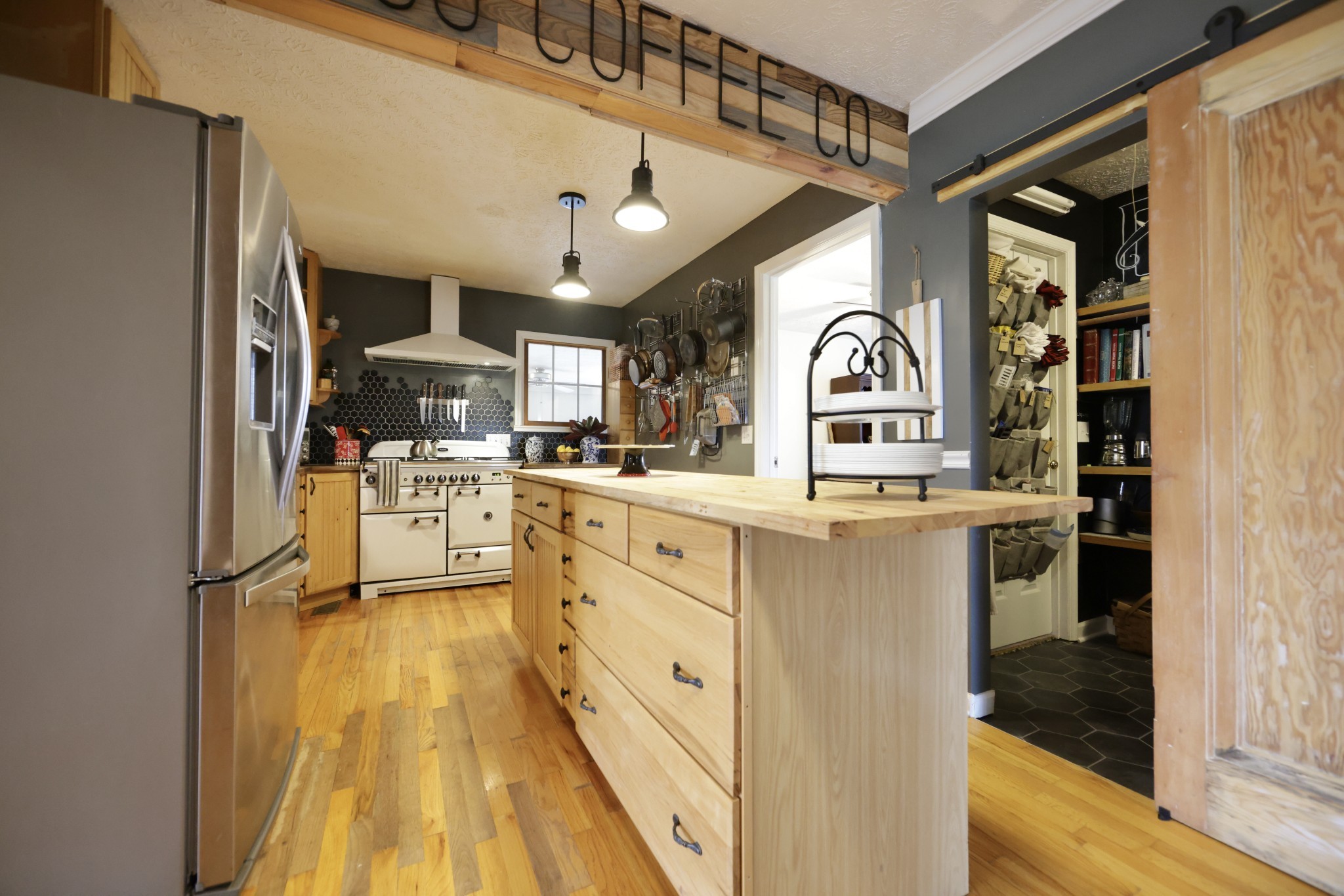 6808 Hester Road Springfield, TN 37172 - Photo 16 of 50 a kitchen with stainless steel appliances kitchen island granite countertop a refrigerator and a stove top oven
