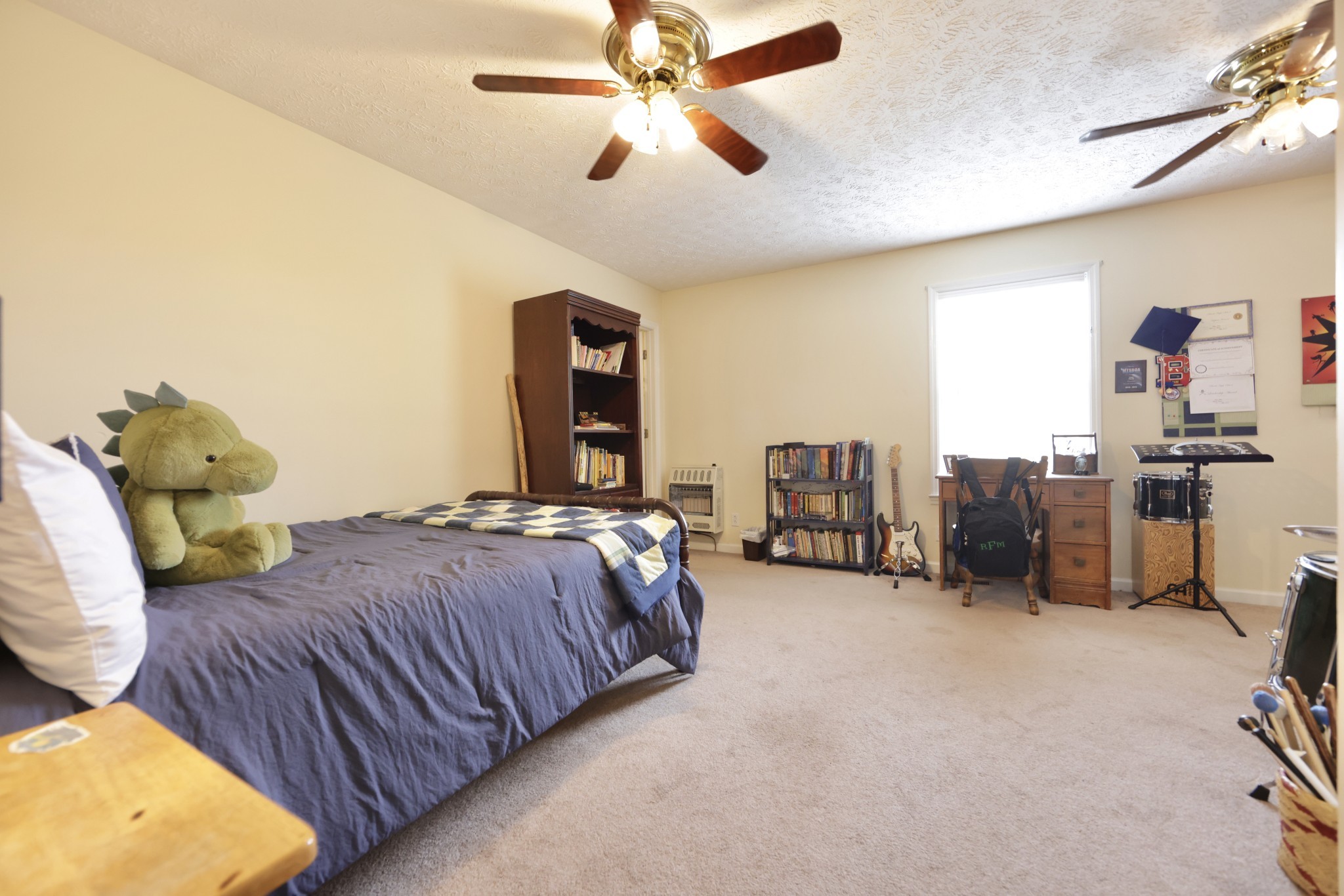 6808 Hester Road Springfield, TN 37172 - Photo 37 of 50 a spacious bedroom with a bed and a chandelier