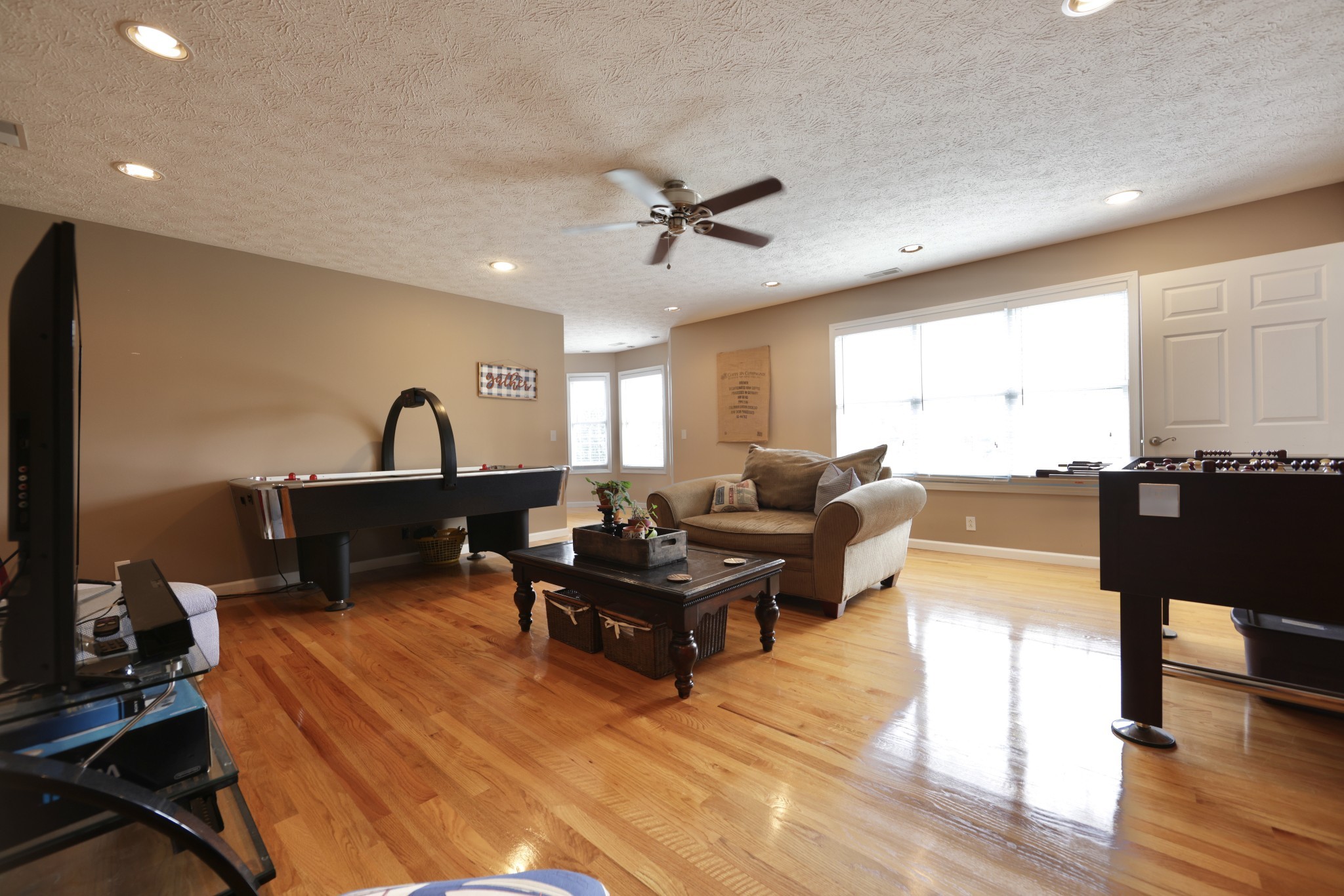6808 Hester Road Springfield, TN 37172 - Photo 43 of 50 a living room with furniture a flat screen tv and kitchen view