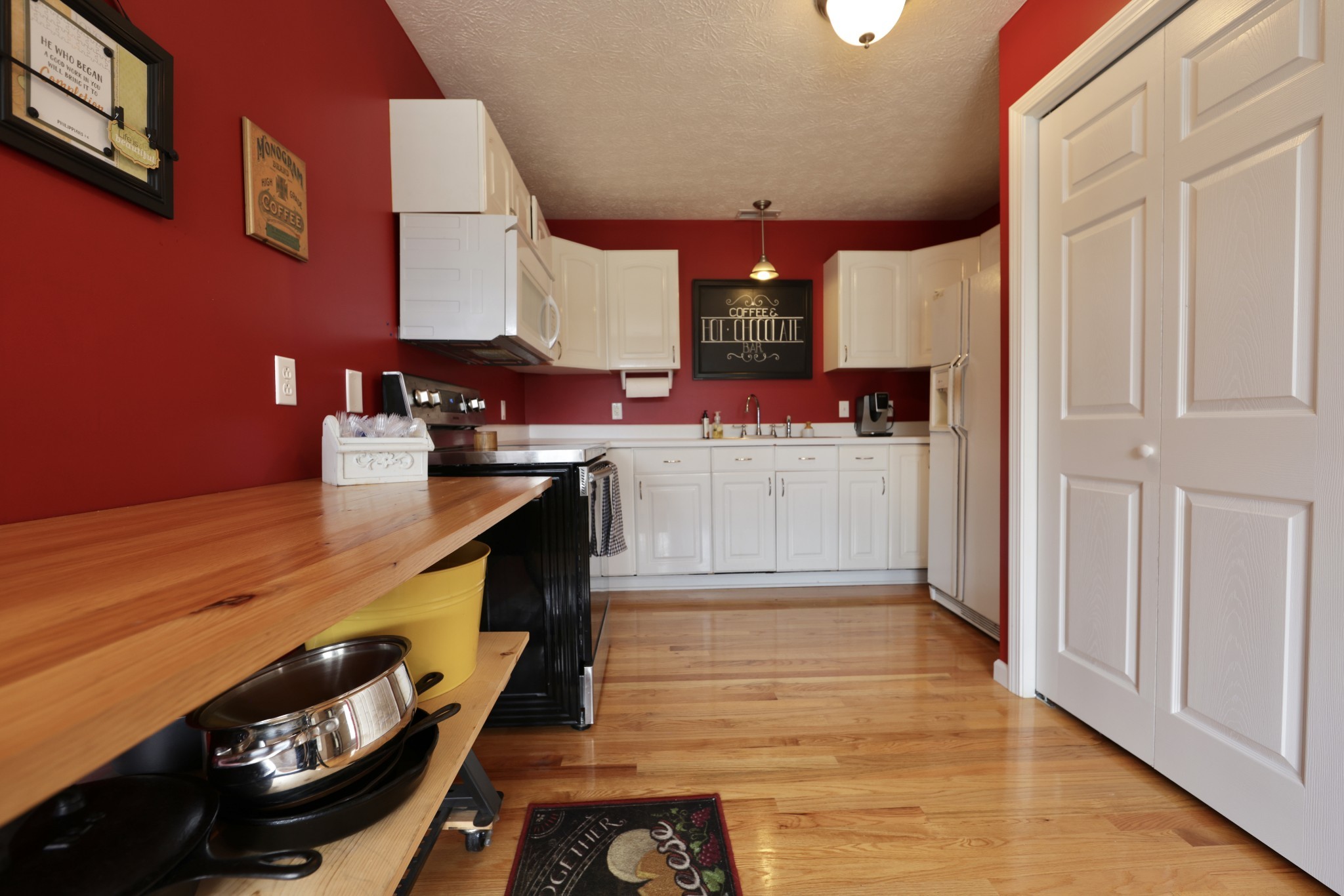 6808 Hester Road Springfield, TN 37172 - Photo 46 of 50 a open kitchen with stainless steel appliances granite countertop a stove and a refrigerator
