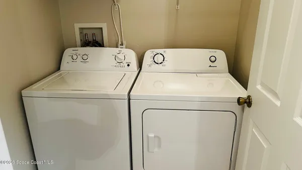 a utility room with dryer and washer