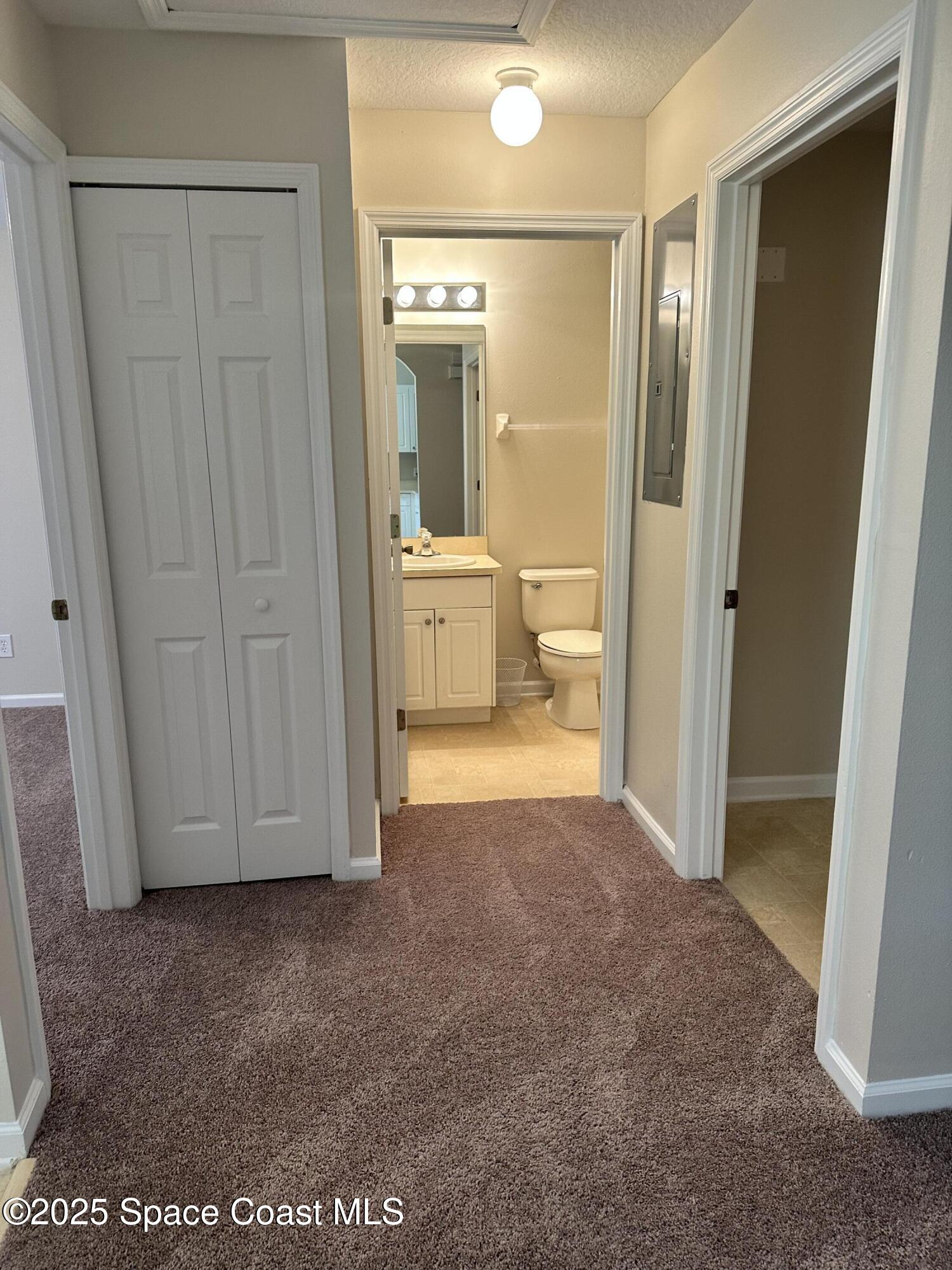 975 Luminary Circle, Unit 103 Melbourne, FL 32901 - Photo 6 of 11 a view of a bathroom with a glass door shower