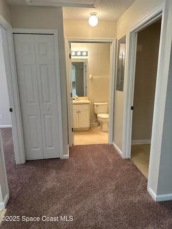 a view of a bathroom with a glass door shower