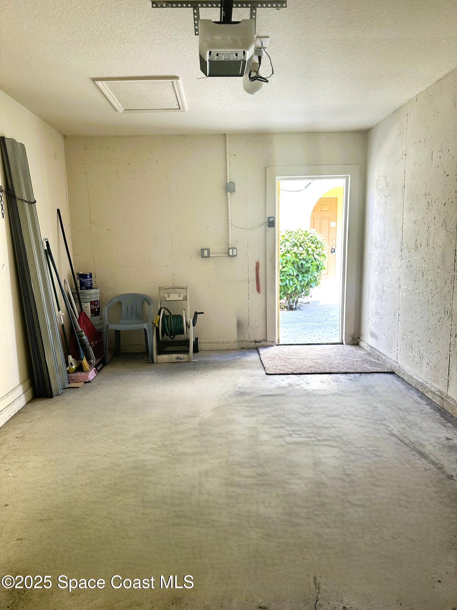 975 Luminary Circle, Unit 103 Melbourne, FL 32901 - Photo 9 of 11 a view of a room with furniture and a window