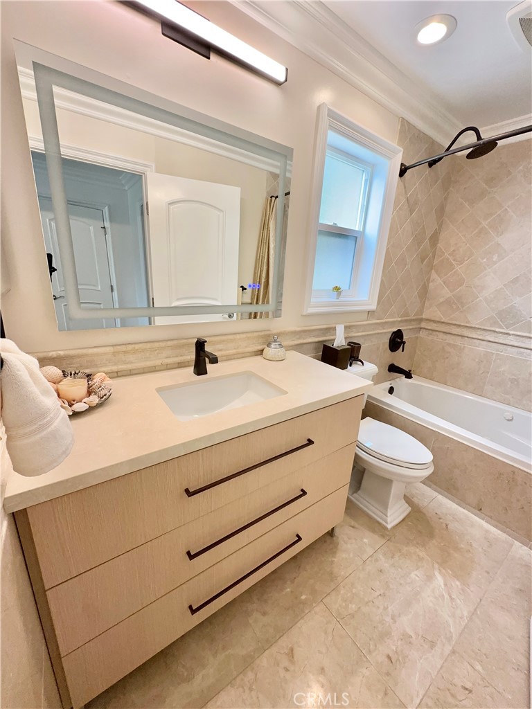 15 Curl Drive Corona del Mar, CA 92625 - Photo 12 of 26 a bathroom with a sink and a mirror