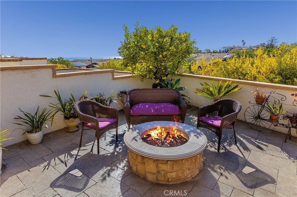 15 Curl Drive Corona del Mar, CA 92625 - Photo 17 of 26 a view of a chairs and table in the terrace