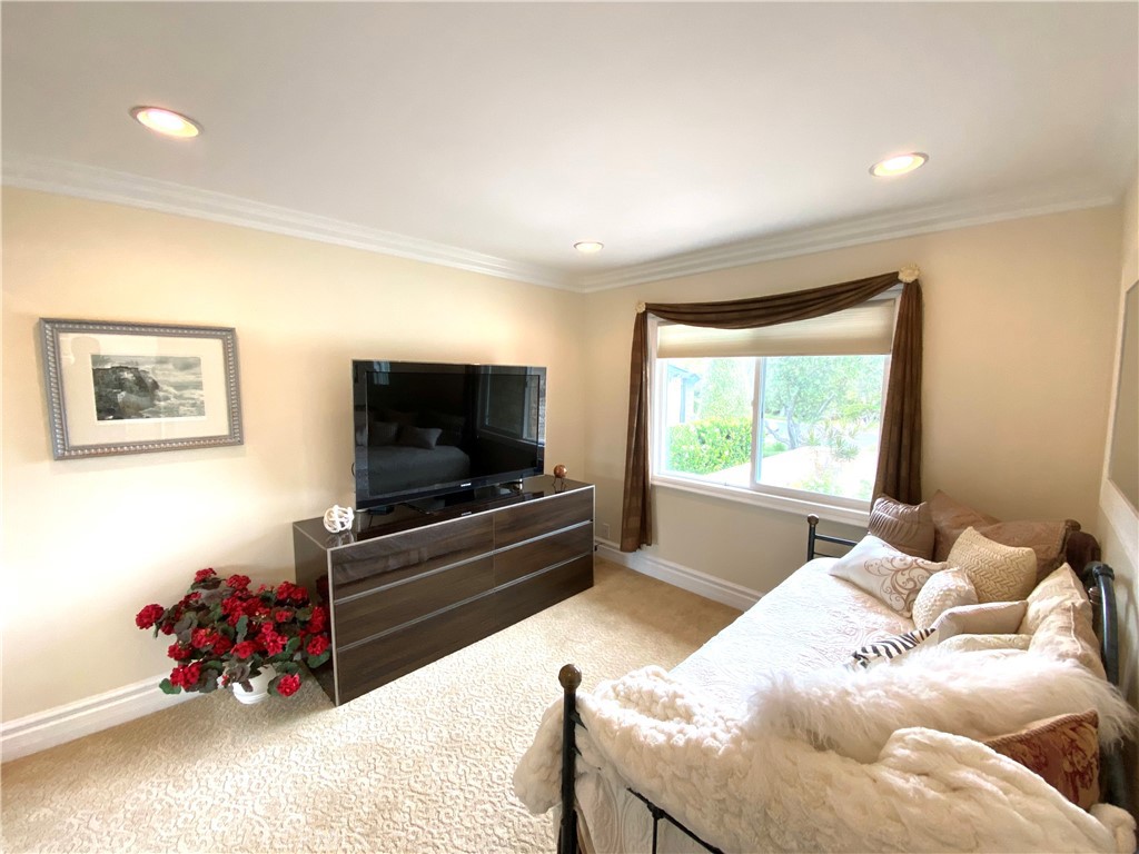 15 Curl Drive Corona del Mar, CA 92625 - Photo 18 of 26 a bedroom with furniture and a flat screen tv