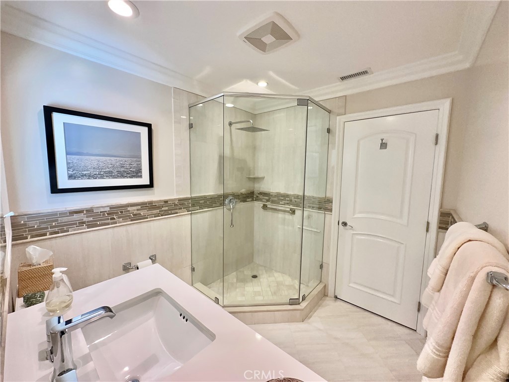 15 Curl Drive Corona del Mar, CA 92625 - Photo 20 of 26 a bathroom with a bathtub and a shower