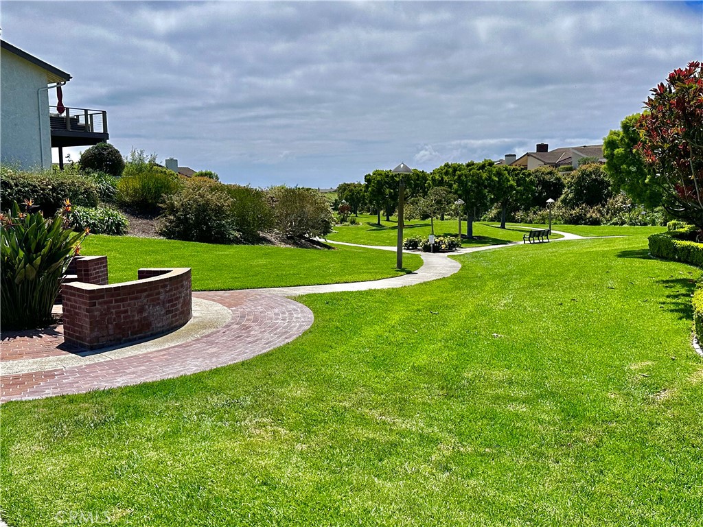 15 Curl Drive Corona del Mar, CA 92625 - Photo 26 of 26 a view of a garden and front view of a house