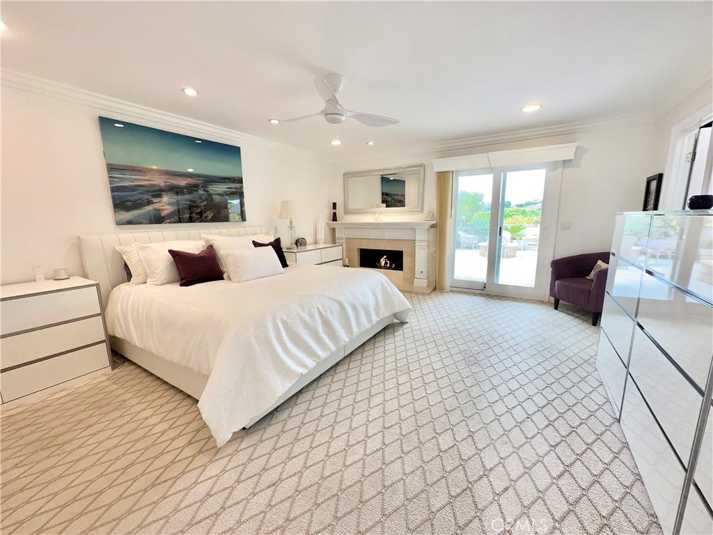 15 Curl Drive Corona del Mar, CA 92625 - Photo 6 of 26 a bedroom with a large bed and a flat screen tv