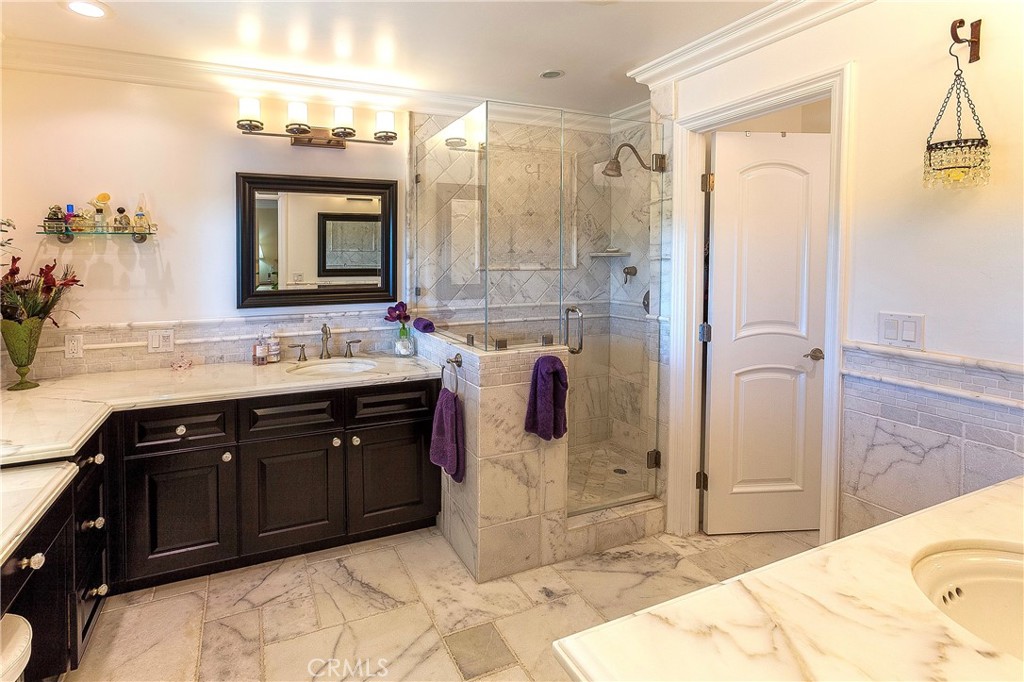 15 Curl Drive Corona del Mar, CA 92625 - Photo 9 of 26 a spacious bathroom with a tub sink and mirror